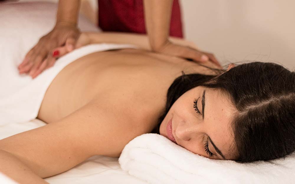 Young woman during an original Thai massage treatment at the My Thai Center in Bologna.
