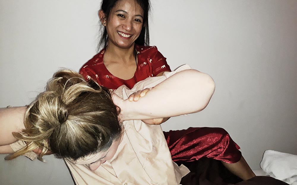 Lisa McQuery, U.S. travel writer, during a Thai Massage session at the My Thai Center in Bologna, Italy.